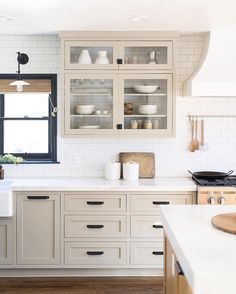 a kitchen filled with lots of white counter top space