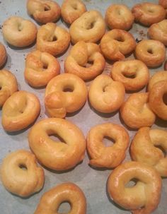 there are many donuts on the baking sheet