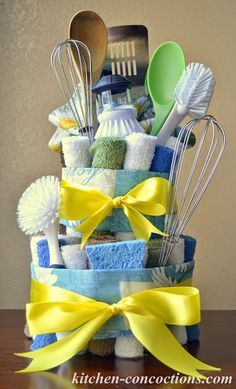 a cake made out of towels and kitchen utensils