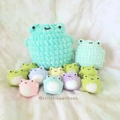 a group of small crocheted animals sitting next to each other