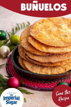 a stack of tortillas sitting on top of a pan next to christmas ornaments