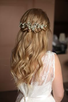 the back of a woman's head wearing a bridal hair piece