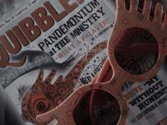 there are two pairs of scissors in front of the advertisement for rubbles on display