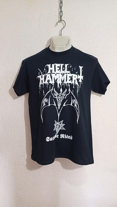 HELLHAMMER SATANIC RITES T-SHIRT New Hellhammer T-Shirt High Quality We'll shipping worldwide. Shipping time range. United States = 20-25 business days Rest of the world = 25-30 business days Celtic Frost, Mercyful Fate, Venom, Black Metal, Tee Shirt, Tee Shirts, Adult Outfits, United States, T-shirt