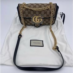 Gucci Gg Marmont Mini Shoulder Bag Black & Brown Gucci Ladies Shoulder Bag. Sku: 446744 Hvkeg 9772. Color: Black. Gucci Gg Marmont Mini Bag. Brown And Black Gg Marmont Shoulder Bag From Gucci Is Constructed From The Brand’s Signature Gg Supreme Canvas And Leather. It Is Enhanced By An Embroidered Pattern And A Logo. The Sliding Chain Strap Smoothly Transforms From A Single Shoulder Length To A Doubled Top Handle Length For Multiple Ways To Wear The Bag. Featuring Half-Round Chain Handle, Main In Gucci Marmont Mini Bag, Gg Marmont Mini Bag, Gucci Gg Marmont Mini, Gg Marmont Mini, Bags Gucci, Gucci Gg Marmont, Gg Marmont, Shoulder Bag Black, Mini Shoulder Bag