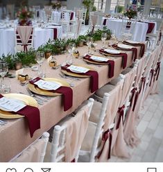 the table is set up with place settings for guests to sit down and enjoy their meal