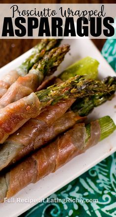 asparagus wrapped in bacon on a white plate