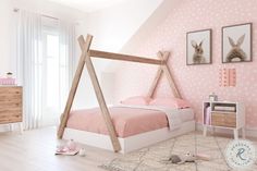 a bedroom with pink walls and white bedding has a wooden frame for the canopy