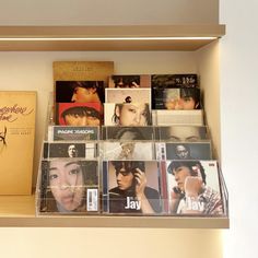 the shelves are filled with cd's, cds and other music memorabilia on display