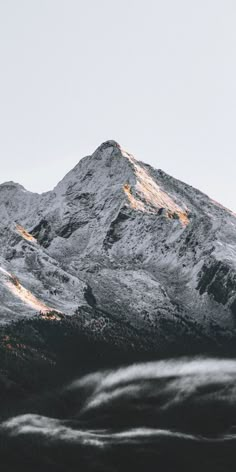 the top of a mountain covered in snow