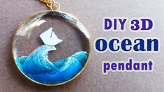 an origami boat floating in the ocean under a glass dome with text that reads diy 3d ocean pendant