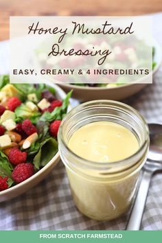 a bowl of salad next to a jar of dressing with the words honey mustard dressing easy, creamy and 4 ingredients