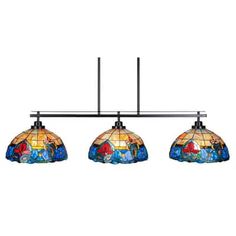 three lights hanging from a metal bar with stained glass shades on the top and bottom