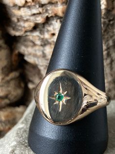 A gents vintage signet ring in the traditional style , plain oval top 15mm x 12mm with a star set Emerald approximately 3mm in diameter, Hallmarked in London 1966, Size Y or US 12  7.3gms Emerald Signet Ring, Oval Signet Ring, Signet Rings, Signet Ring, Traditional Style, Class Ring, In London, Emerald, Jewelry Rings