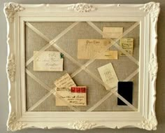 a white frame with lots of post it notes on it