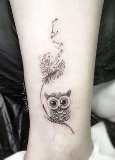 an owl with dandelion tattoo on the ankle is shown in black and white