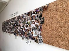 a cork bulletin board with pictures pinned to it