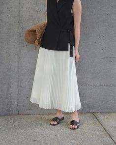 This effortless look is giving us some cool-girl summer vibes. The star of the show? Our Chiffon Pleated Midi Skirt, of course. The flattering, wrinkle-resistant fabric looks gorg paired with a more minimalist top and black sandals. Give this skirt a twirl at the fair price of $49.90. Midi Flowy Skirts, Cheap Pleated Midi Skirt, Skirts Fir Summer, Cheap Spring Midi Pleated Skirt, Cheap Cotton Relaxed Pleated Skirt, Cheap Fitted Cotton Pleated Skirt, Pleated Skirts Midi, Luxury Pleated Hem Midi Skirt, Affordable Pleated Full Skirt