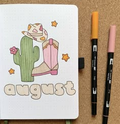 a notebook with an image of a cactus and the word august written in large letters