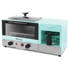 a toaster oven sitting on top of a white counter next to a glass container