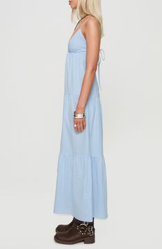 This charming maxi dress is cut from lightweight cotton and fashioned with an open, strappy back and flowy tiers. Adjustable back tie closure V-neck Spaghetti straps Lined 100% cotton Machine wash, line dry Imported Breezy Tiered Maxi Dress For Summer, Blue Cotton Maxi Dress For Spring, Summer Vacation Tiered Maxi Dress, Casual Summer Tiered Maxi Dress, Summer Tiered Sundress Maxi Dress, Summer Maxi Tiered Dress, Cotton Tiered Summer Beach Dress, Spring Vacation Cotton Tiered Dress, Chic Cotton Tiered Dress For Vacation