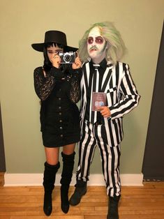 two people dressed up as beetle and jack skellinger, one holding a camera