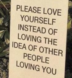 a sign that says, please love yourself instead of loving the idea of other people loving you