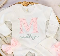 Introducing our adorable newborn coming home outfit - the perfect coming home outfit for your precious little one! This custom infant outfit features a beautiful, personalized baby romper, made with love and care to welcome your baby into the world. Our baby clothes are crafted from the softest fabrics and designed to ensure your baby's comfort. This makes a thoughtful and unique baby shower gift, newborn photography or a special addition to your little one's wardrobe. I take pride in creating o Fitted Cotton Sets For First Birthday, Pink Long Sleeve Baptism Sets, Pink Long Sleeve Sets For Baptism, Cotton Onesie For Baptism, Pink Cotton Baptism Onesie, Fitted Pink Onesie With Name Print, Pink Cotton Onesie With Name Print, Pink Fitted Onesie With Name Print, Spring Baptism Cotton Onesie