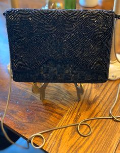 "This is a gorgeous vintage DELTA hand beaded black purse. It was made in 1960's and is is stunning condition. It is lightweight and charming.  Bring this purse to add some sparkle to your happy places! Great for a Mother's Day gift too! Excellent vintage condition! This elegant purse is approx 5\" tall and 7\" across. The metal chain can be tucked in purse. Length of chain is approx 22\" long. NO rips, tears, smells, or beads missing. Looks like new! Thanks for stopping by my Etsy shop. Keri" Clutch Purse Wedding, Elegant Purse, Purse Wedding, Wedding Purse, Black Purse, Black Purses, Hand Beading, Clutch Purse, Black Beads