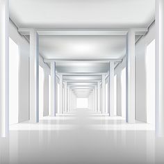 an empty room with white walls and columns