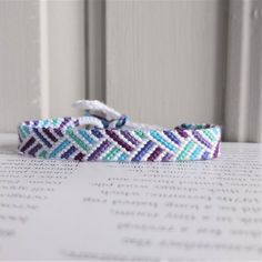 a close up of a bracelet on a table