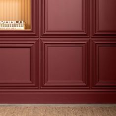 a room with red walls and wooden floors