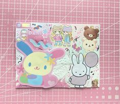 a pink background with various stickers on it and a teddy bear in the center