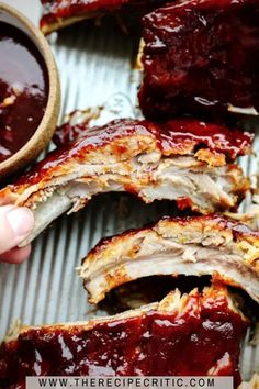 the ribs are covered in bbq sauce and ready to be cut into wedges