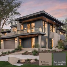 the exterior of a modern home at dusk