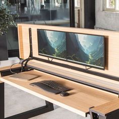 a computer monitor sitting on top of a wooden desk