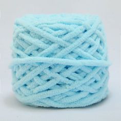 a ball of blue yarn on a white background