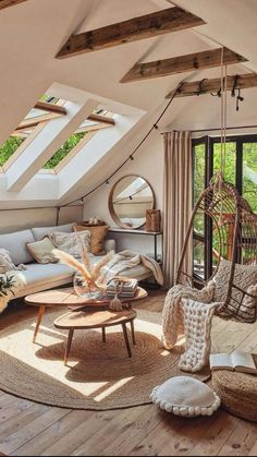 a living room filled with lots of furniture and windows covered in skylights, including a hammock hanging from the ceiling