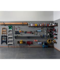 there is a garage with many tools hanging on the wall