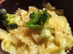 pasta with broccoli and cheese in a bowl