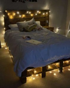 a bed that has some lights on it