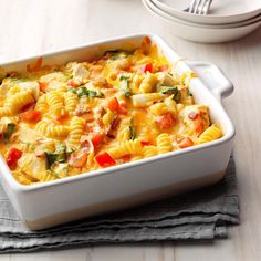 a casserole dish filled with pasta and vegetables