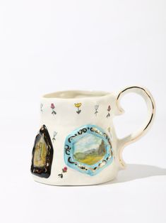 Discover the enchanting charm of our Pastoral Panorama Coffee Mug, a delightful blend of whimsy and craftsmanship. Each mug is a canvas, featuring hand-painted pastoral scenes encased in decorative frames, reminiscent of a stroll through a fairytale landscape. Fairytale Landscape, Mugs Aesthetic, Bridesmaid Mug, Decorative Frames, Wine Collection, Frame Decor, Gift Card Shop, Wine Glasses, Shop House