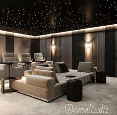 a room with couches, chairs and lights on the ceiling is lit by stars