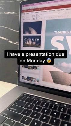 an open laptop computer sitting on top of a table