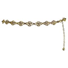 Presenting an incredible gold-tone Gianni Versace chain belt designed by Donatella Versace. Since the early 2000s, this chic belt has been constructed with gold-tone Versace Medusa logo links. This fabulous Gianni Versace chain belt is a must-have addition to any wardrobe or collection! Approximate Measurements: Length: 29 - 33" Width: 0.75" 2000 Belt, Luxury Gold Chain Belt, Versace Chain Belt, Luxury Gold Metal Chain Belt, Gold Versace Necklace, Versace Chain, Luxury Gold-tone Metal Chain Belt, Versace Jewelry, Versace Gold