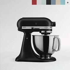 an image of a black kitchen mixer on a white background with color swatches behind it