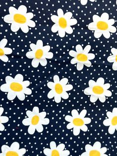 white and yellow flowers on black polka dot fabric