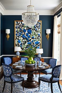 a dining room with blue chairs and a chandelier