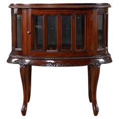 a wooden cabinet with glass doors on the top and bottom shelf, in an antique style